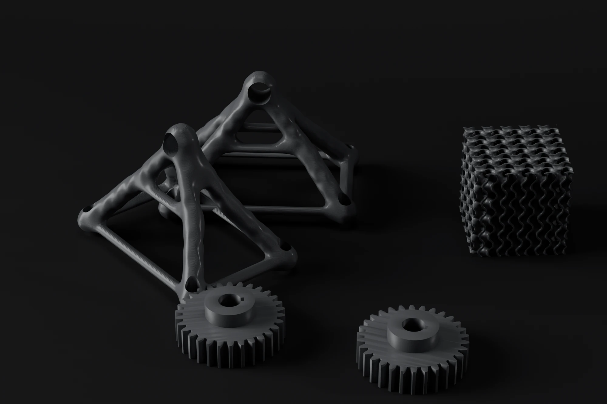 Several different printed parts: two lattice brackets, two gears and a gyroid cube